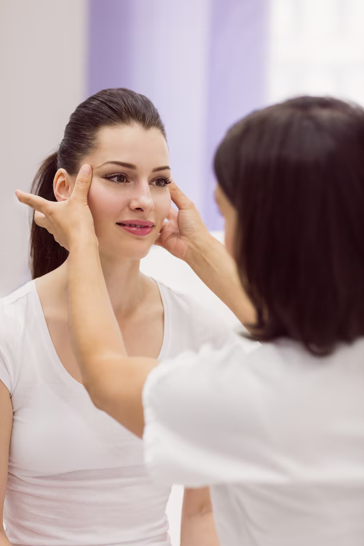 dermatologist-examining-female-patient-skin